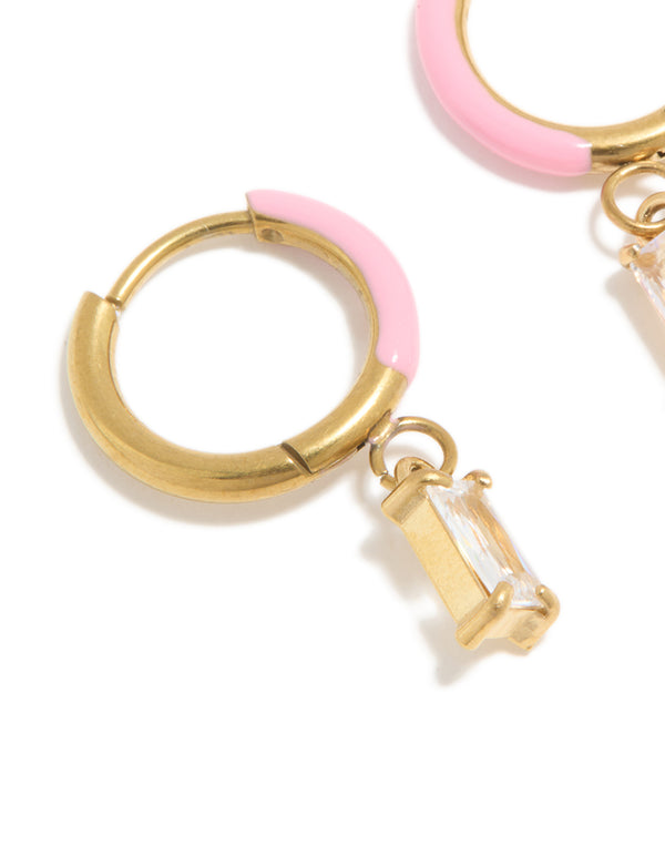 Crafted from waterproof gold plated stainless steel pink enamel cubic zirconia charm huggie earrings close up view