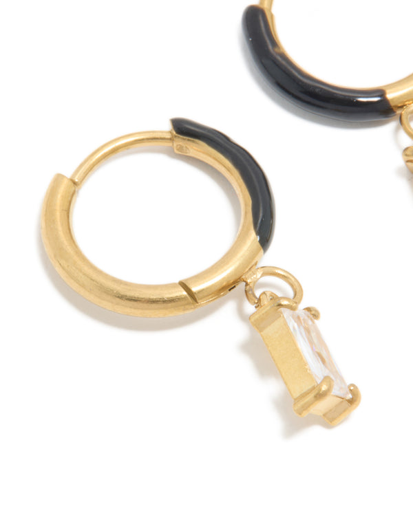 Crafted from waterproof gold plated stainless steel black enamel cubic zirconia huggie earrings with charm in a statement style close up view