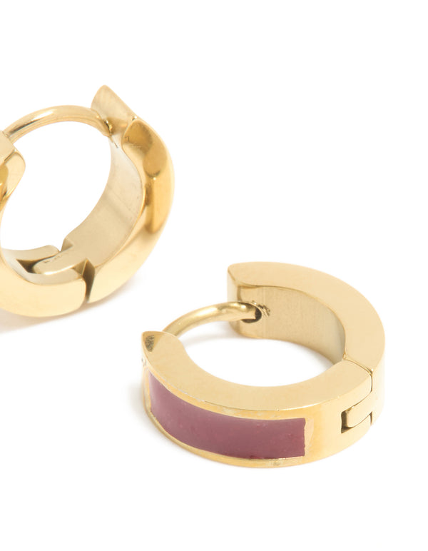 Highlighting waterproof gold plated stainless steel with burgundy red enamel inlay, these small statement huggie earrings post detail view