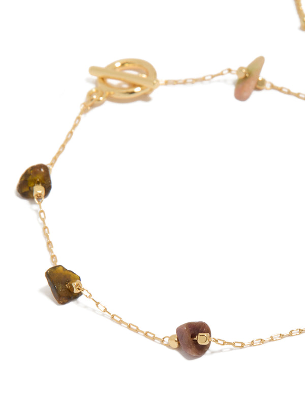 Showcasing gold plated bracelet set with semi-precious stones and beads close up view