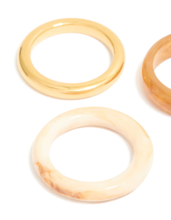Designed with waterproof gold plated stainless steel and marbled stacking rings 3-pack close up view
