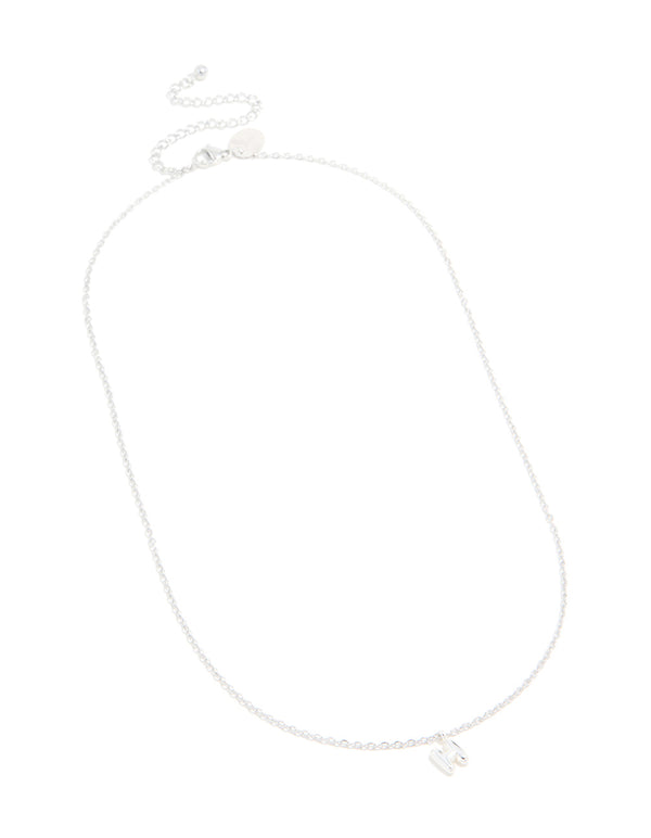 Showcasing a waterproof stainless steel mini bubble letter H necklace with initial pendant in dainty style silver close up view