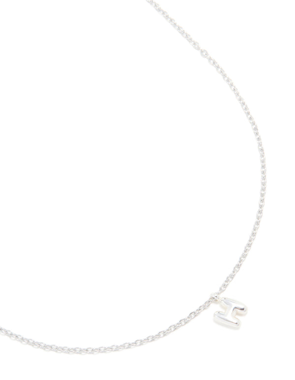 Showcasing a waterproof stainless steel mini bubble letter H necklace with initial pendant in dainty style silver close up view