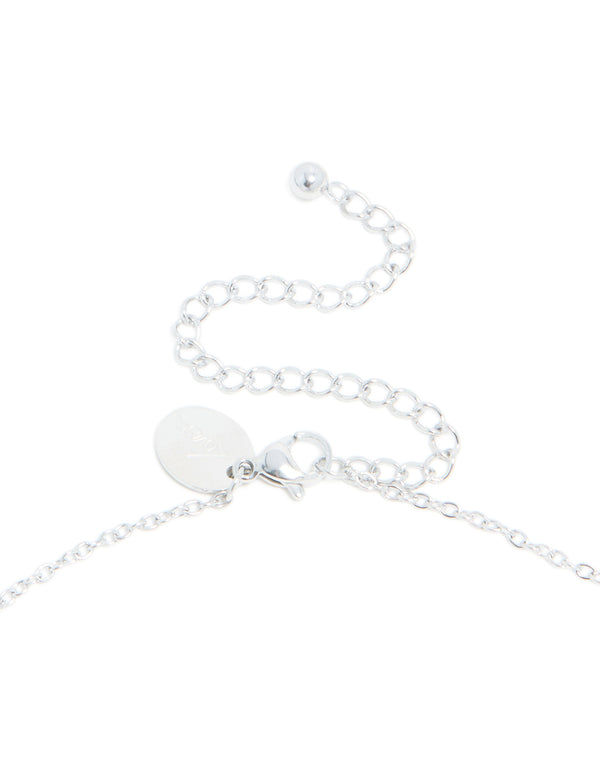 Highlighting waterproof stainless steel mini bubble letter X necklace with initial pendant in silver clasp detail view