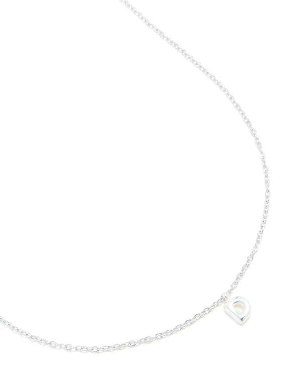Crafted from waterproof stainless steel, mini bubble letter D necklace with initial featuring pendant in silver close up view