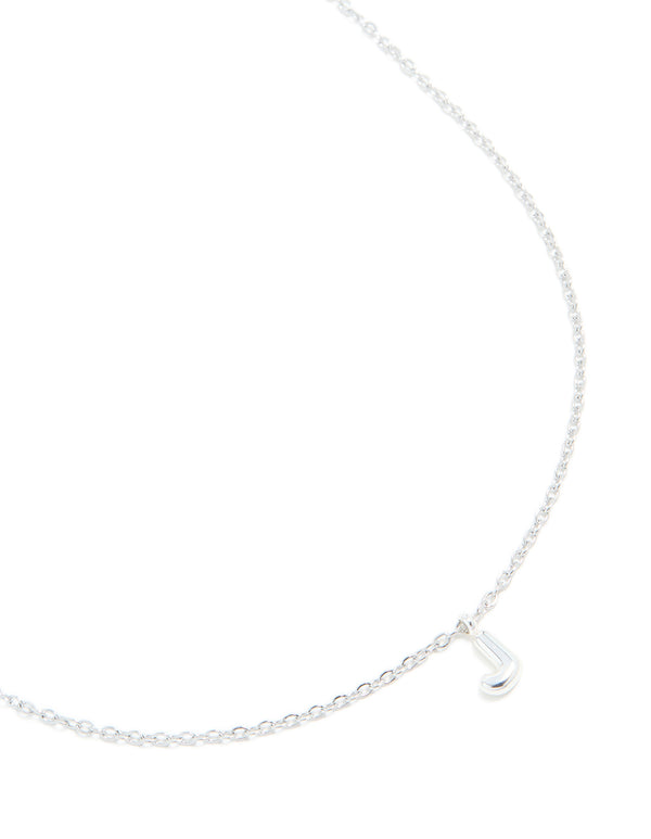 Showcasing a waterproof stainless steel mini bubble letter J necklace with featuring initial pendant in silver close up view