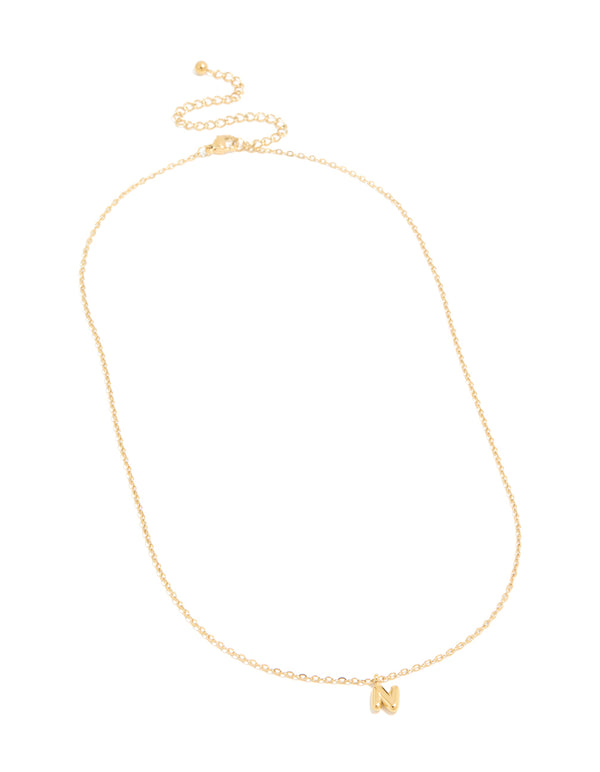 Designed with a waterproof bubble letter N initial pendant in gold plated stainless steel front view