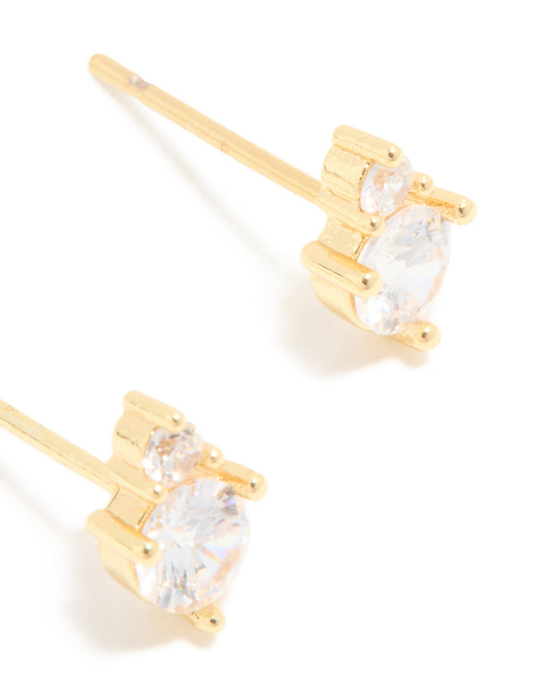 Showcasing waterproof gold plated stainless steel construction with round cubic zirconia in clear, these duo stud earrings offer a detailed look post detail view