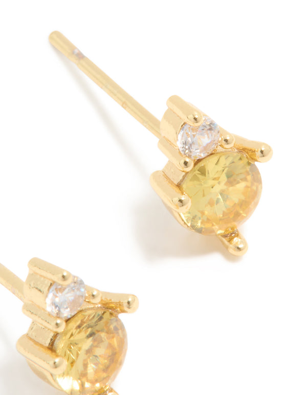 Designed with waterproof stainless steel November cubic zirconia duo stud earrings in gold with yellow and clear stones post detail view