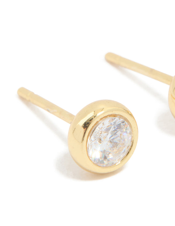 Showcasing waterproof gold plated stainless steel bezel set stud earrings with round cut cubic zirconia close up view