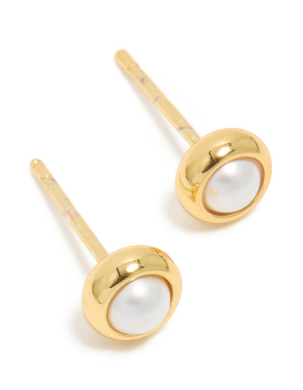 Showcasing waterproof gold plated stainless steel pearl bezel set stud earrings in white front view