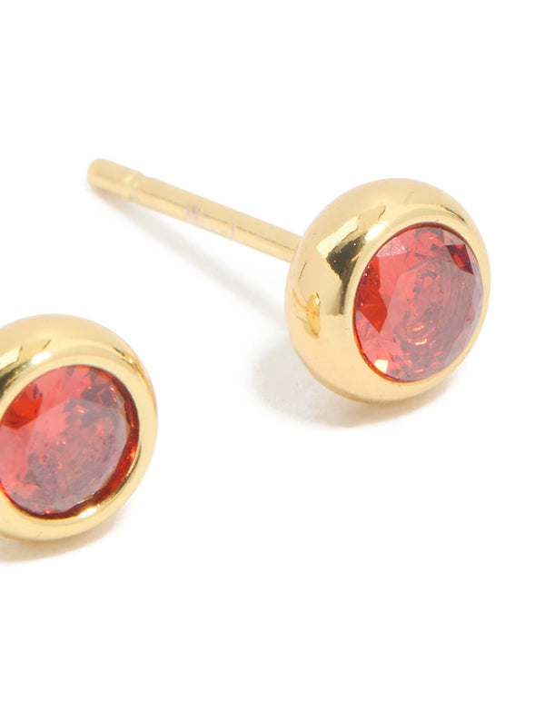 Presenting waterproof stainless steel cubic zirconia January birthstone bezel set stud earrings with round stone cut in gold and crimson post detail view
