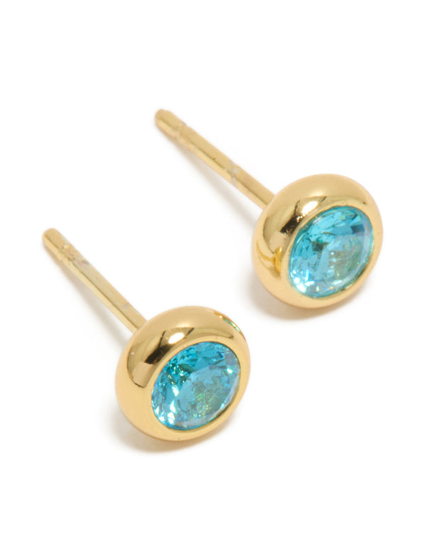 Featuring waterproof gold plated stainless steel aquamarine cubic zirconia March birthstone bezel set stud earrings front view