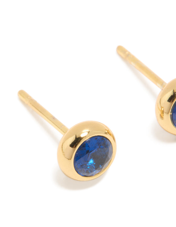 Crafted from waterproof gold plated stainless steel sapphire cubic zirconia September birthstone bezel set stud earrings in dainty style close up view