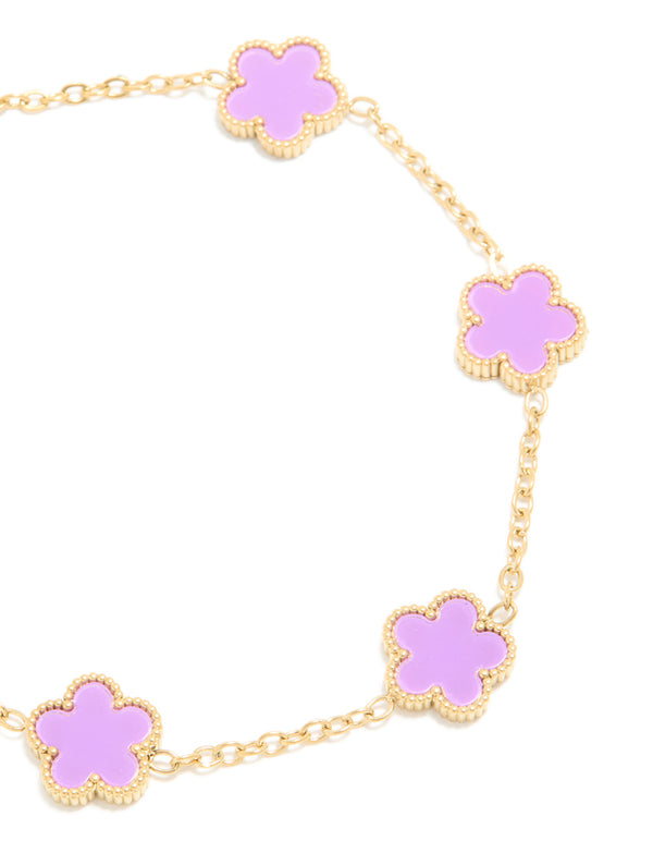 This waterproof gold plated stainless steel light purple petal flower charm bracelet close up view