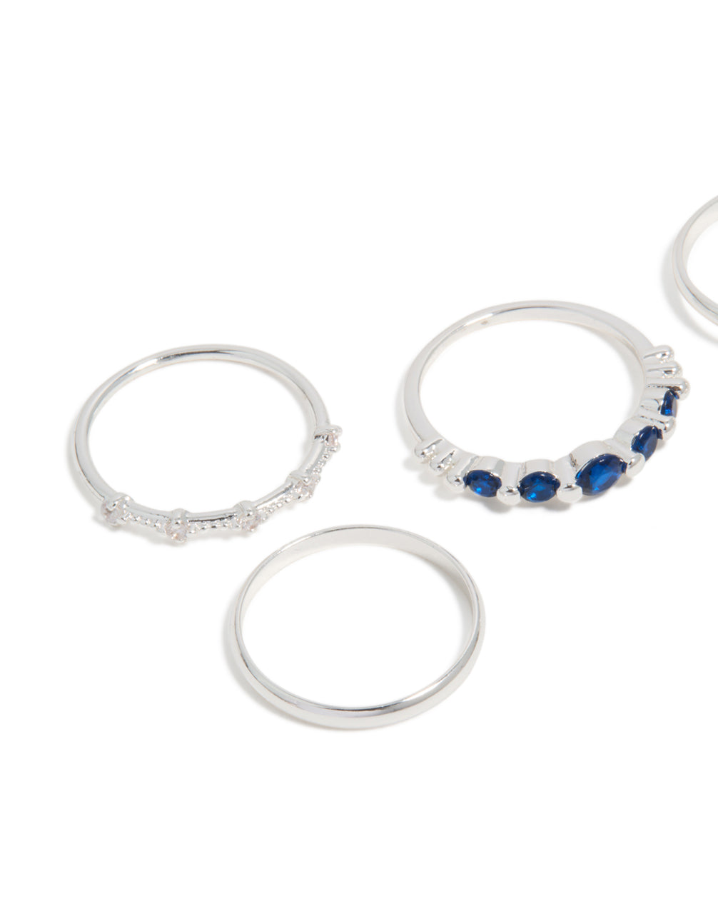 Stunning silver plated dainty cubic zirconia stacking rings 5-pack with navy and clear stones close up view
