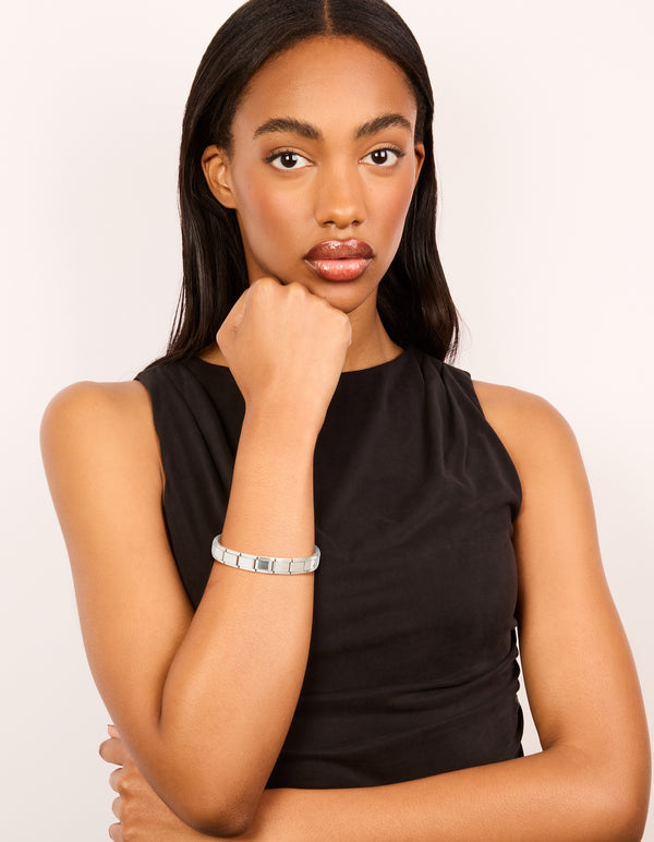Crafted from waterproof stainless steel stretch watch link bracelet in silver on model view