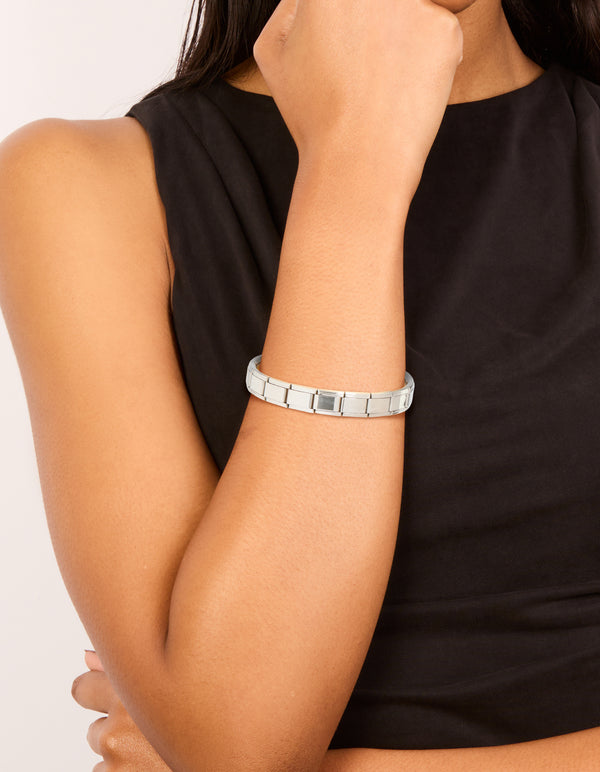 Showcasing a waterproof stainless steel stretch watch link bracelet in silver on wrist view