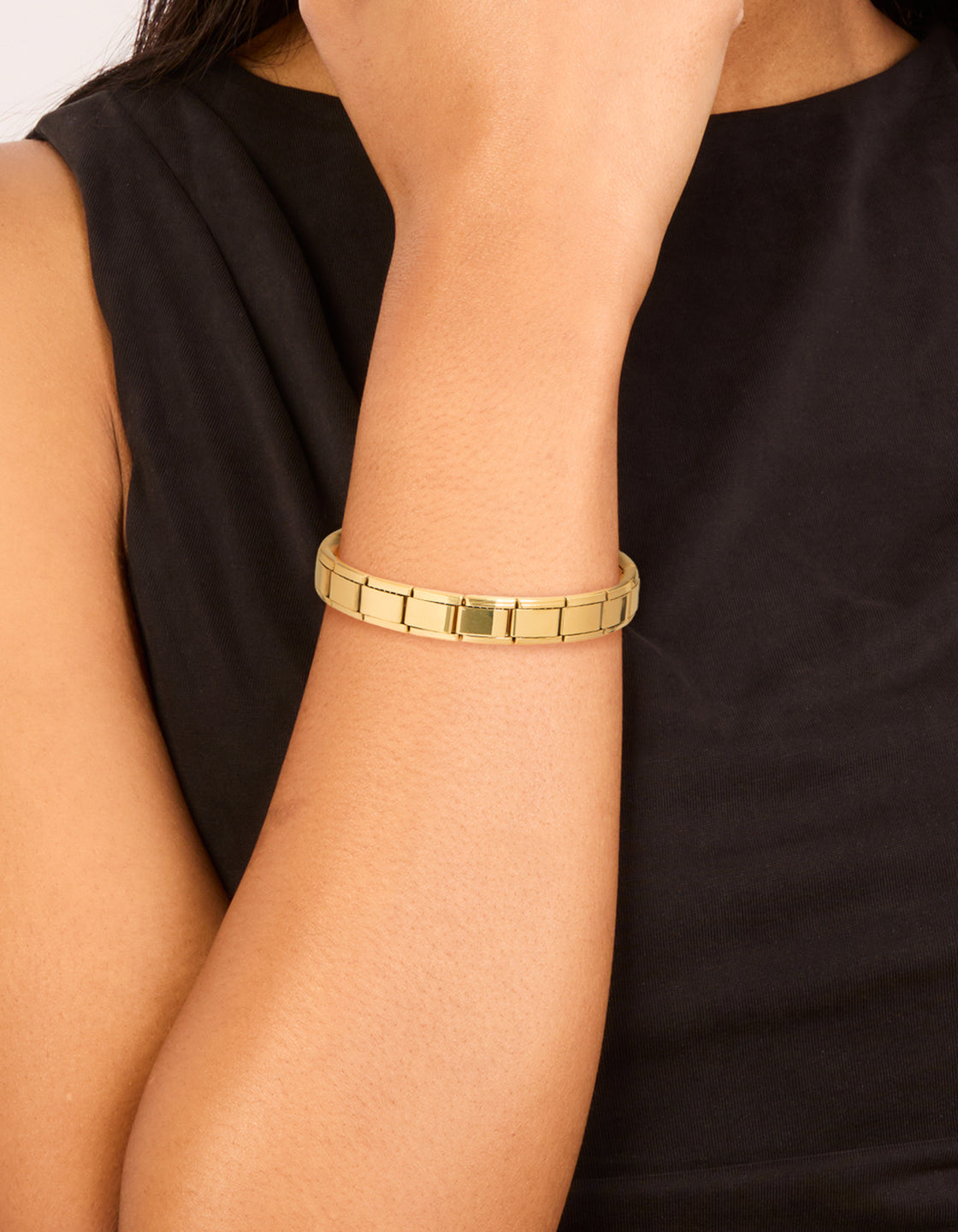 Showcasing a waterproof gold plated stainless steel stretch link bracelet on wrist view