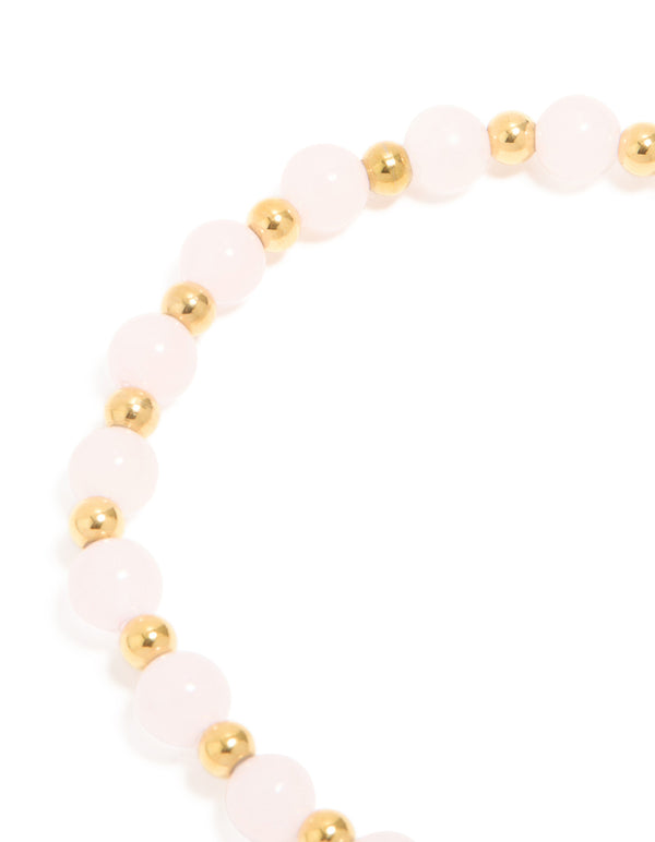 Designed with waterproof gold plated stainless steel and rose quartz beaded stretch bracelet close up view