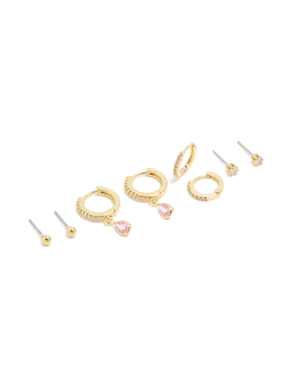 Dainty earrings crafted from gold plated brass with cubic zirconia, featuring balls and pink tourmaline October birthstone in a 4-pack set with stud and huggie closures front view