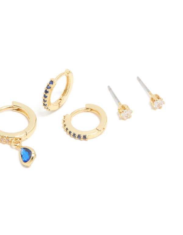 Designed with gold plated brass, sapphire cubic zirconia crystals, ball feature, stud and huggie closure in a 4-pack detail view