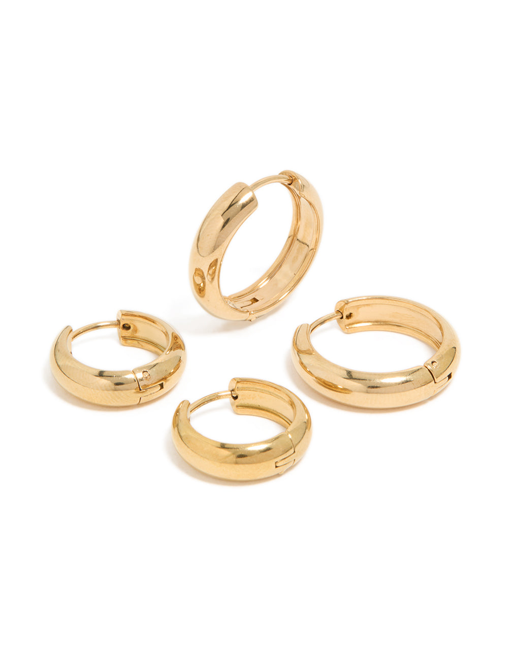 Featuring waterproof gold plated stainless steel thick huggie earrings in a 2-pack with chunky styling in a front view