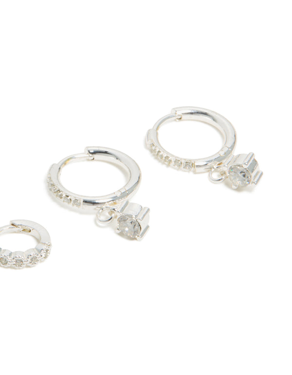 Showcasing waterproof stainless steel cubic zirconia stud and huggie earrings in a 3-pack with charm silver white detail