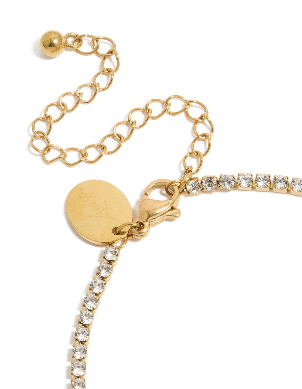 Revealing a waterproof gold plated stainless steel cubic zirconia letter T initial tennis bracelet in closure detail view