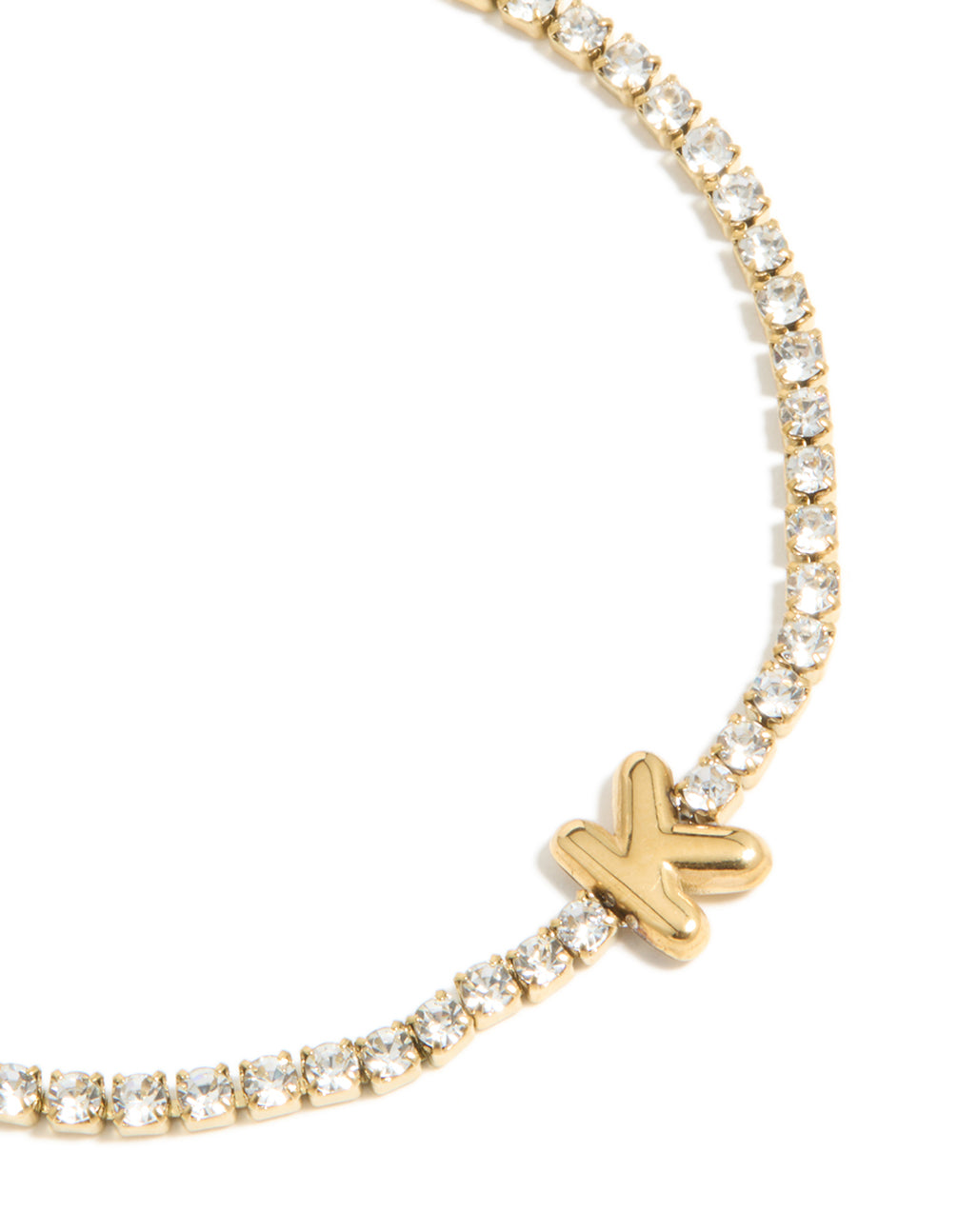 A waterproof gold plated stainless steel letter K initial tennis bracelet in close up view