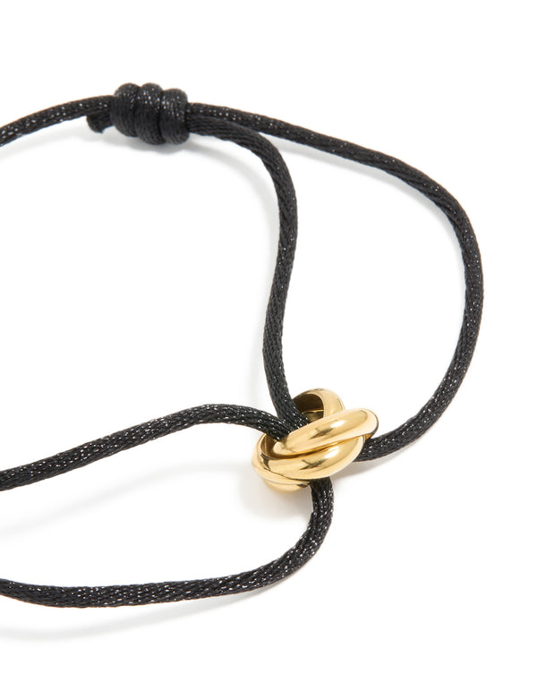 Elegant waterproof gold plated stainless steel and black cord adjustable bracelet close up view
