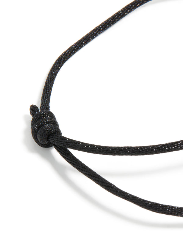 Highlighting the waterproof gold plated stainless steel and black cord adjustable bracelet closure detail view