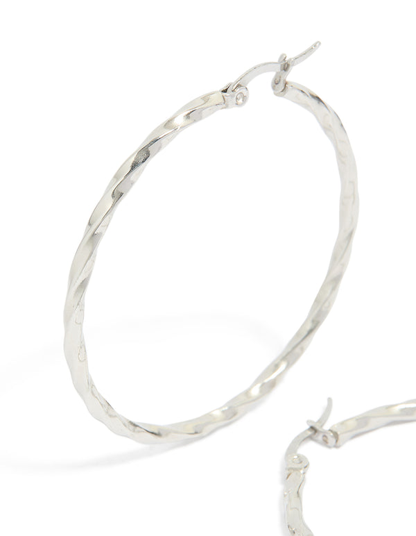 Featuring surgical steel textured hoop earrings in 40 MM with silver closure close up view
