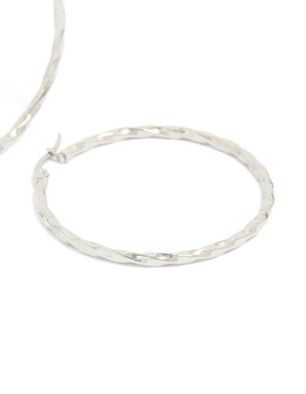 Crafted from surgical steel textured hoop earrings in 40 MM with silver closure post detail view