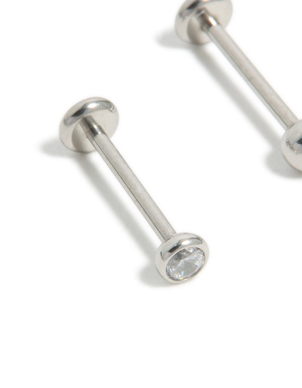 Designed with titanium bezel cubic zirconia threadless flat back nose studs featuring ball accents in silver close up view