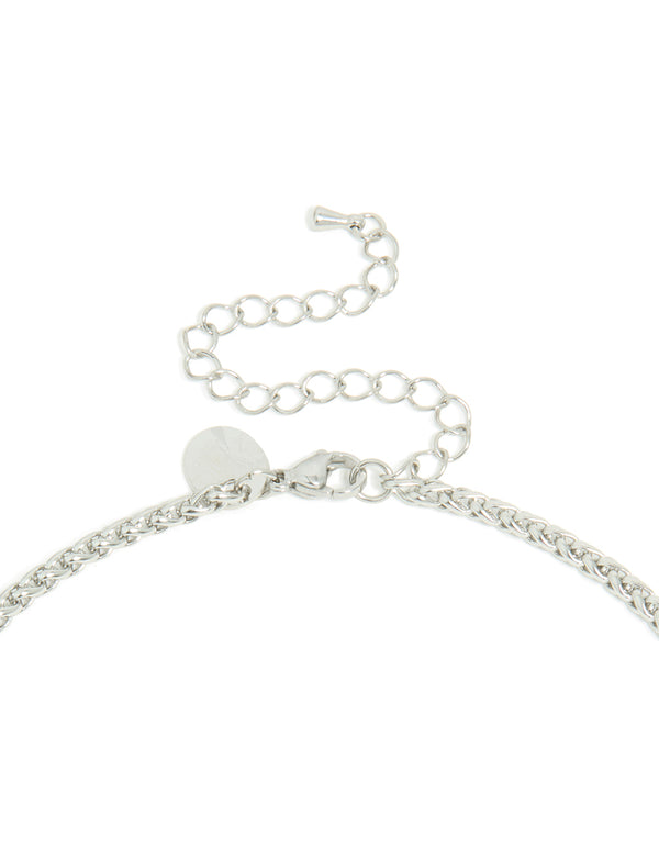 Highlighting a mens waterproof detailed cross pendant necklace in stainless steel and silver clasp detail view