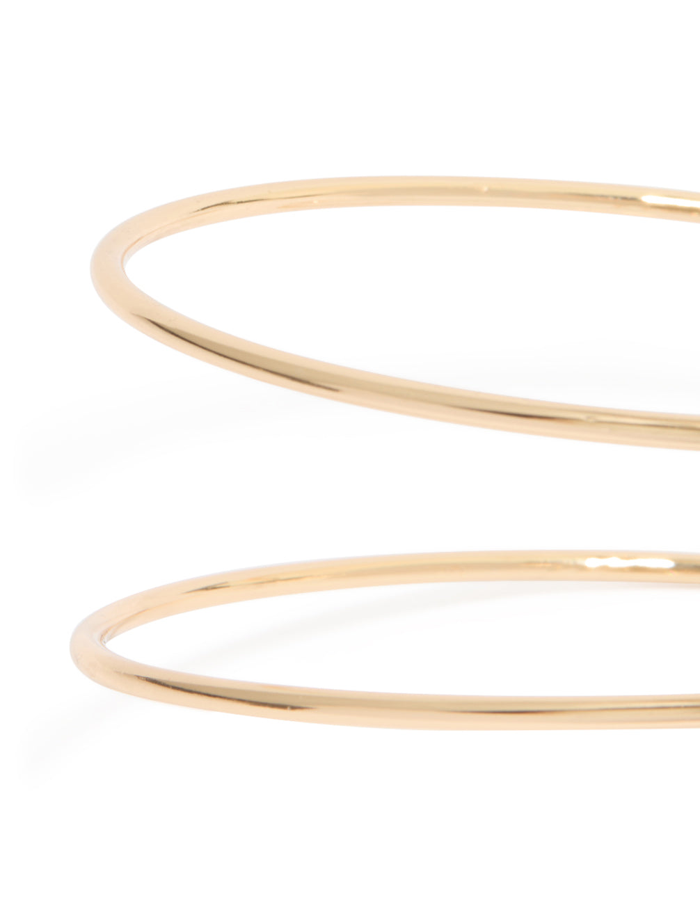 Gold sun and swirl arm cuff with celestial design close up view