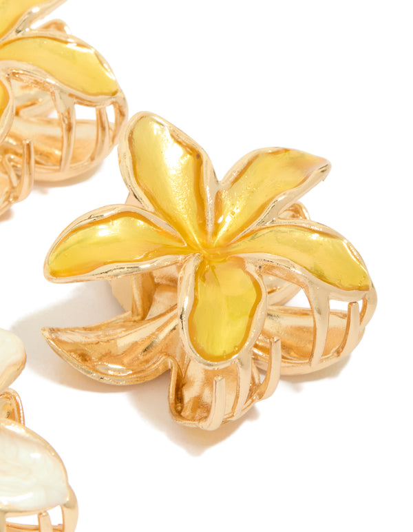 Crafted from enamel, small yellow frangipani flower claw clips in a 4-pack with gold detailing side view