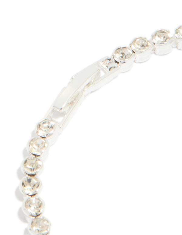 Designed with a silver plated diamante tennis bracelet showcasing clasp mechanism closure detail view