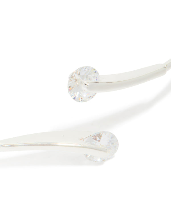 Explore a silver plated cubic zirconia floating wrap around bangle with statement style close up view