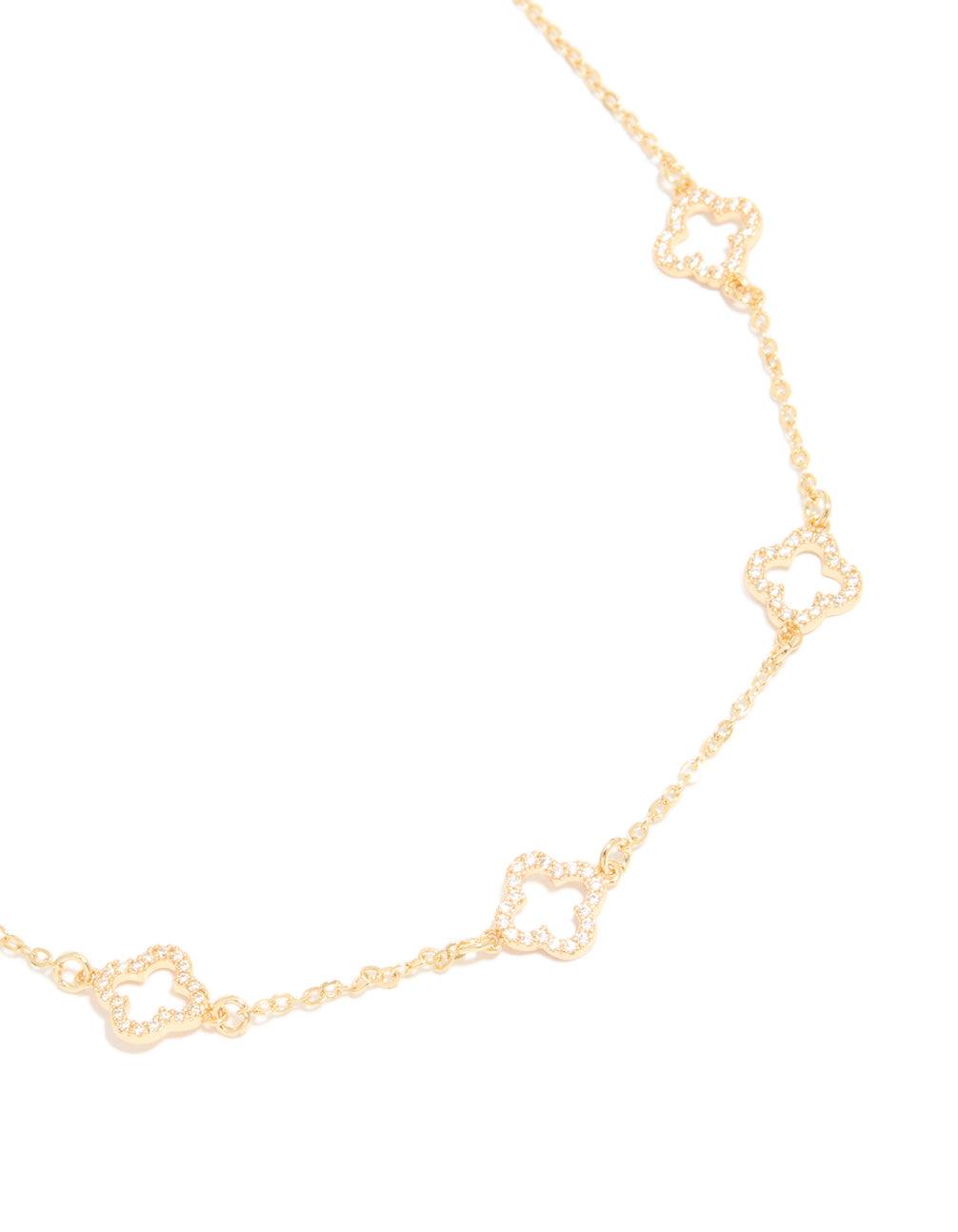 Highlighting this gold plated necklace with cubic zirconia flower charm close up view