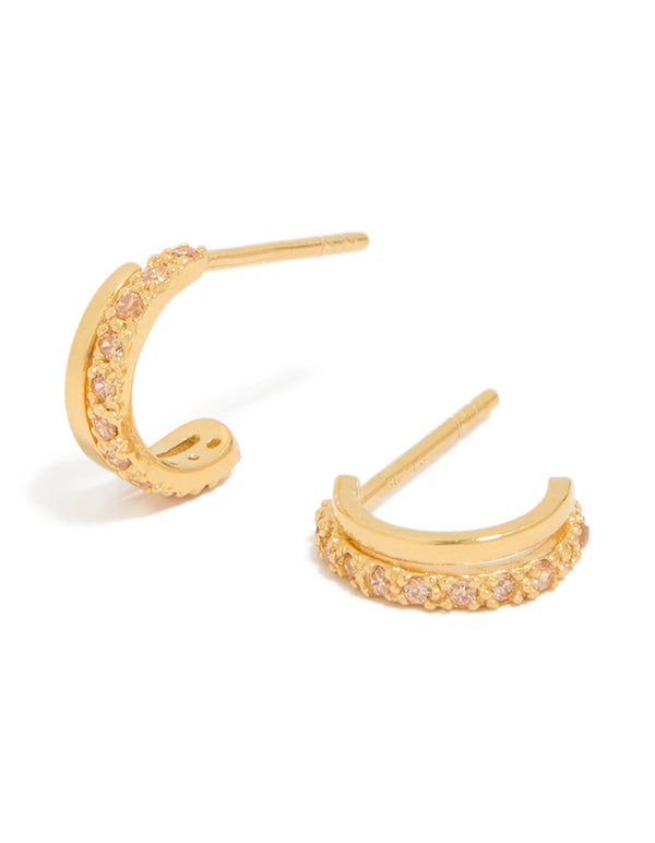 Showcasing gold plated sterling silver cubic zirconia double hoop huggie earrings with pink accents front view