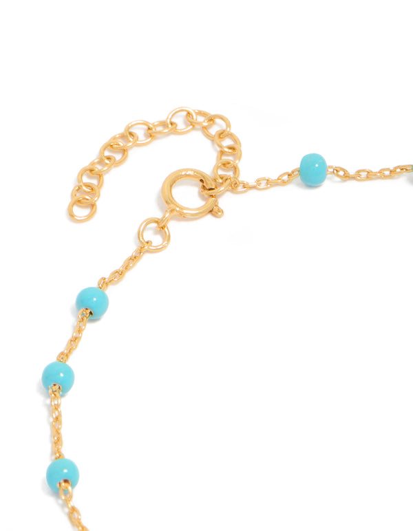 Designed with gold plated sterling silver and blue enamel beads in turquoise station bracelet closure detail view