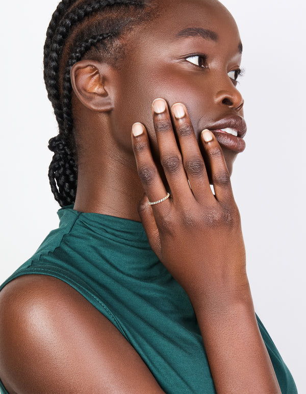 Showcasing a textured black enamel ring crafted from sterling silver with statement style on finger view