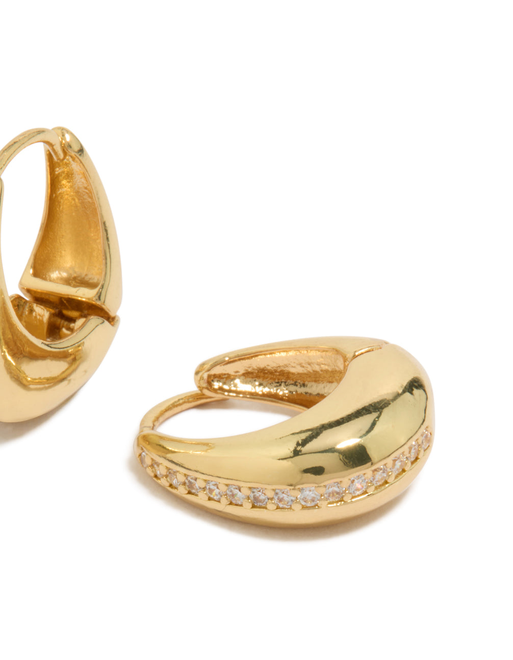 Detailed view of gold plated brass cubic zirconia teardrop huggie earrings highlighting craftsmanship close up view