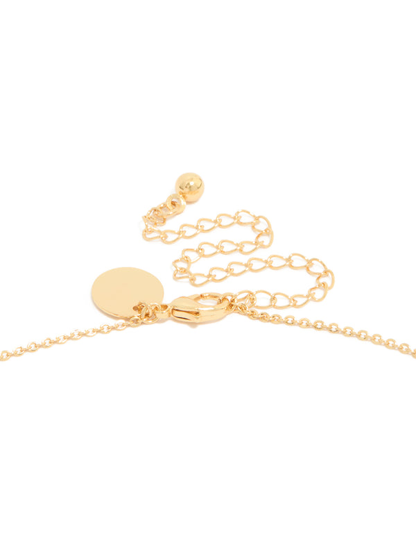 Presenting a brass double cross necklace with charm featuring cubic zirconia in gold plated finish, statement pendant style clasp detail view