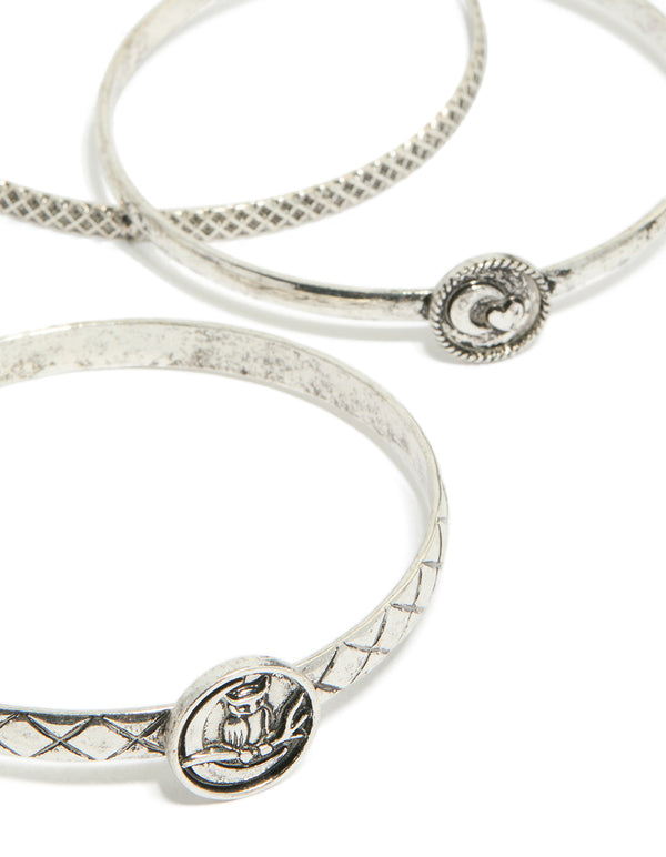 Showcasing silver textured and plain bangles 6-pack with bird, celestial and heart detail in close up view