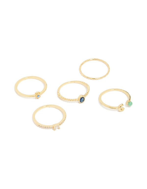 Showcasing gold plated celestial rings featuring moon and star motifs with blue cubic zirconia in a 5-pack front view