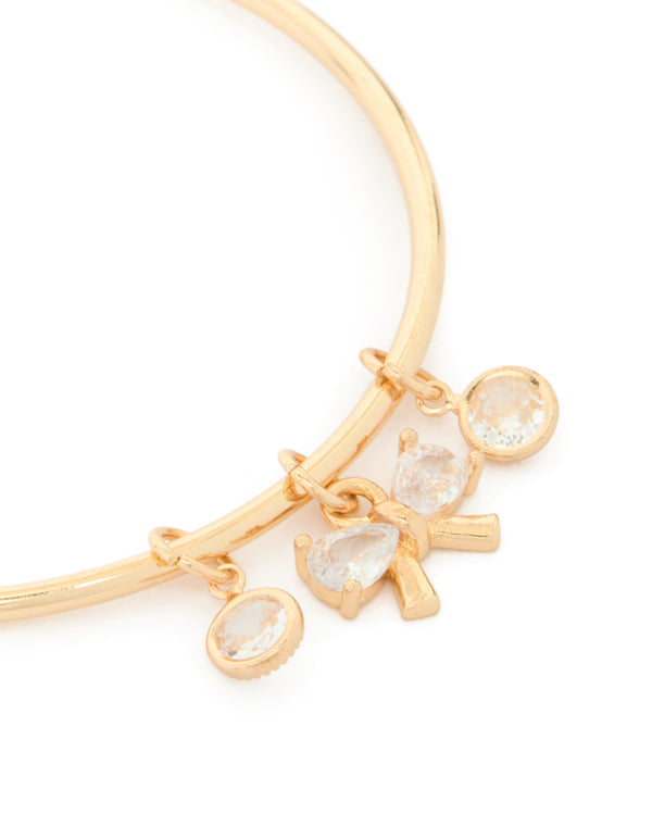 Featuring gold cubic zirconia bow charm toggle bracelet close up view