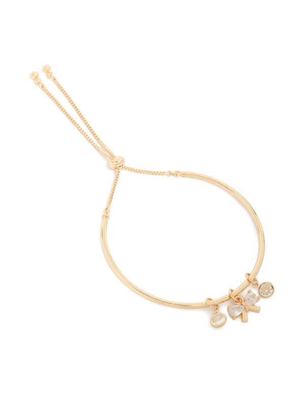 Beautifully designed gold cubic zirconia bow charm toggle bracelet front view